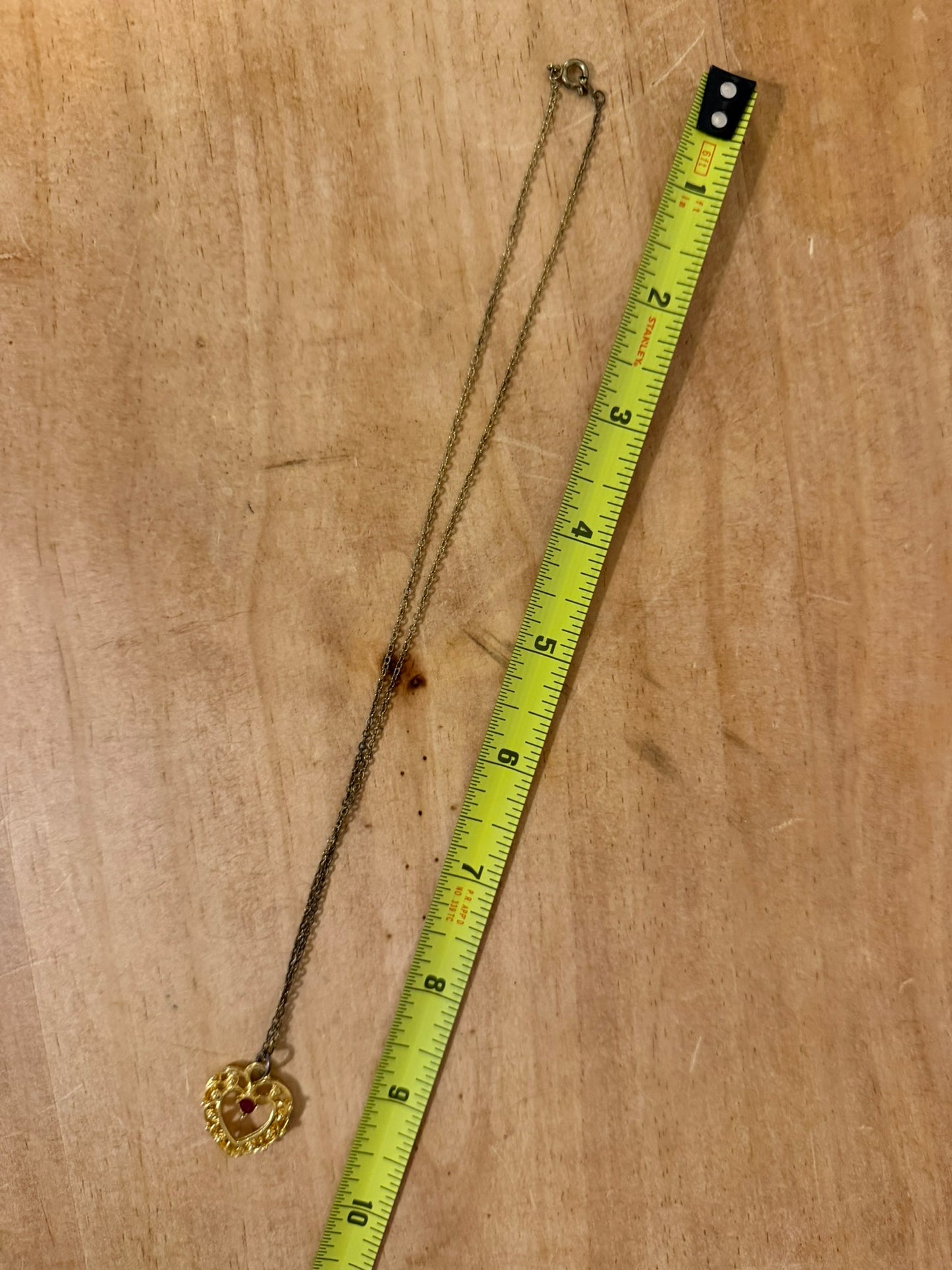 Gold‑Tone Heart Pendant Necklace With Red Center Stone