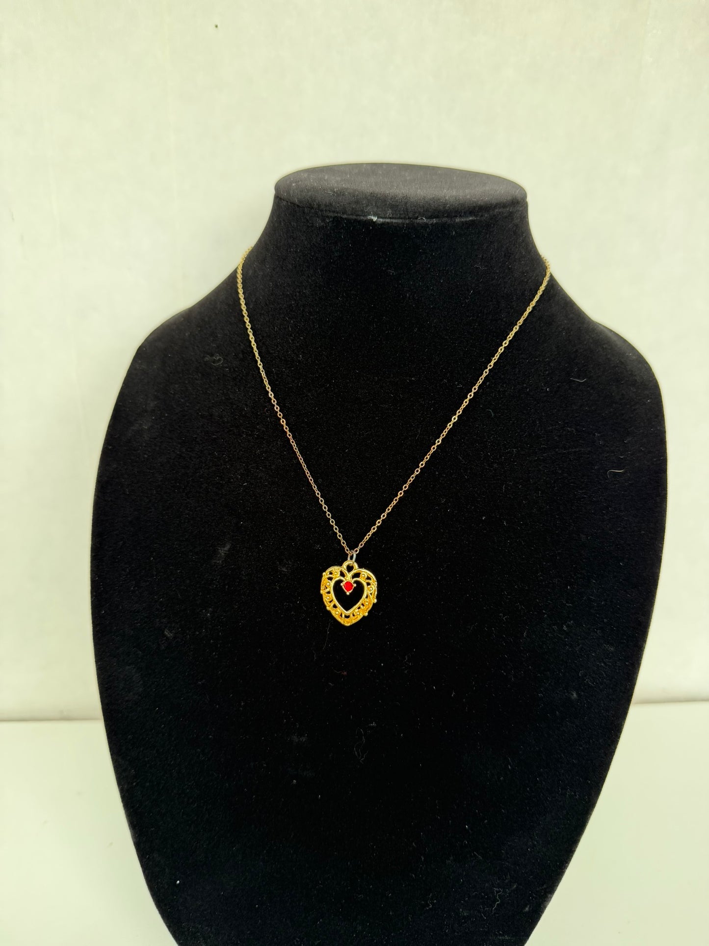 Gold‑Tone Heart Pendant Necklace With Red Center Stone
