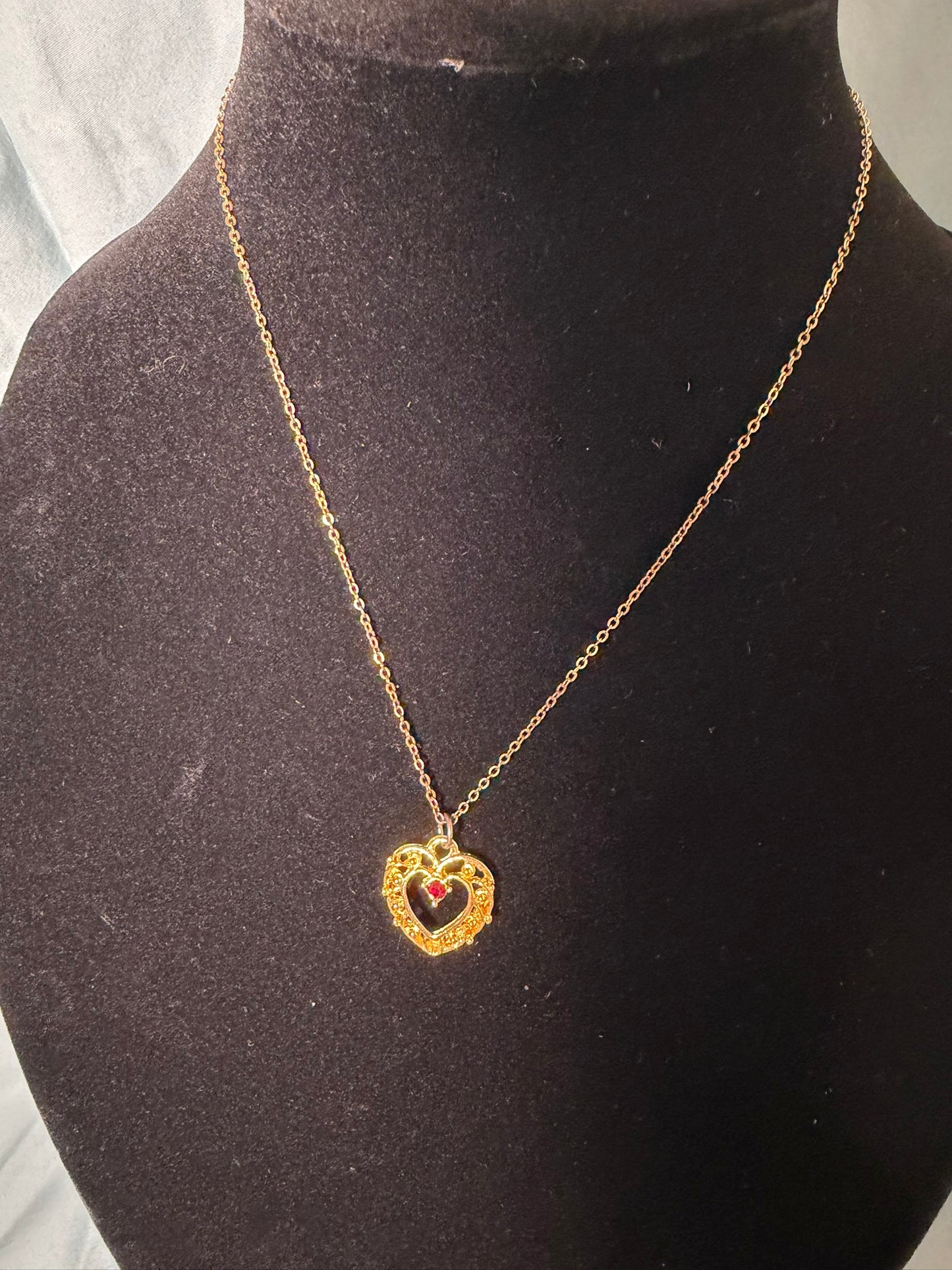 Gold‑Tone Heart Pendant Necklace With Red Center Stone