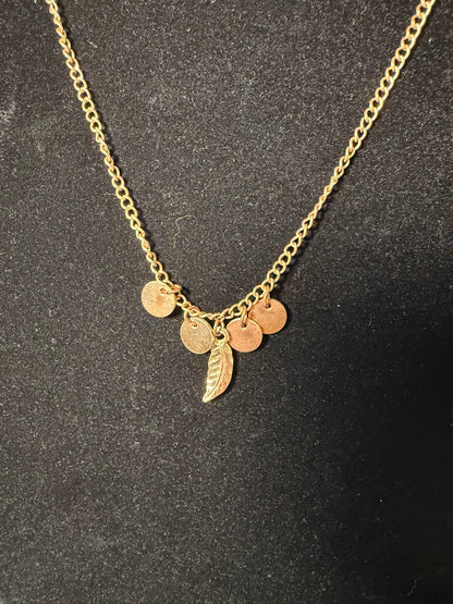 Gold‑Tone Charm Necklace With Mini Disc Accents and Feather Pendant