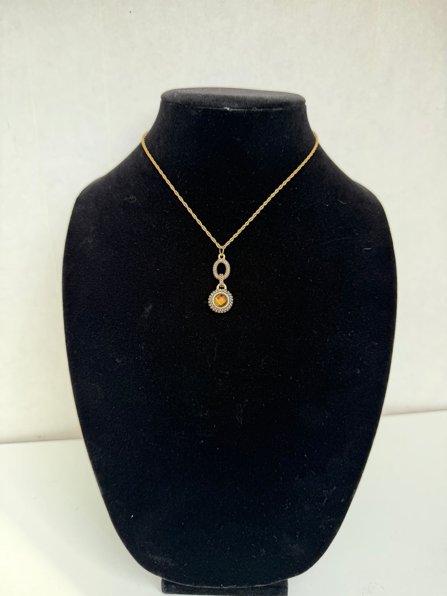 Gold‑Tone Rope Chain Necklace With Two‑Tier Ornate Pendant and Amber‑Colored Center Stone