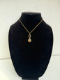 Gold‑Tone Rope Chain Necklace With Two‑Tier Ornate Pendant and Amber‑Colored Center Stone
