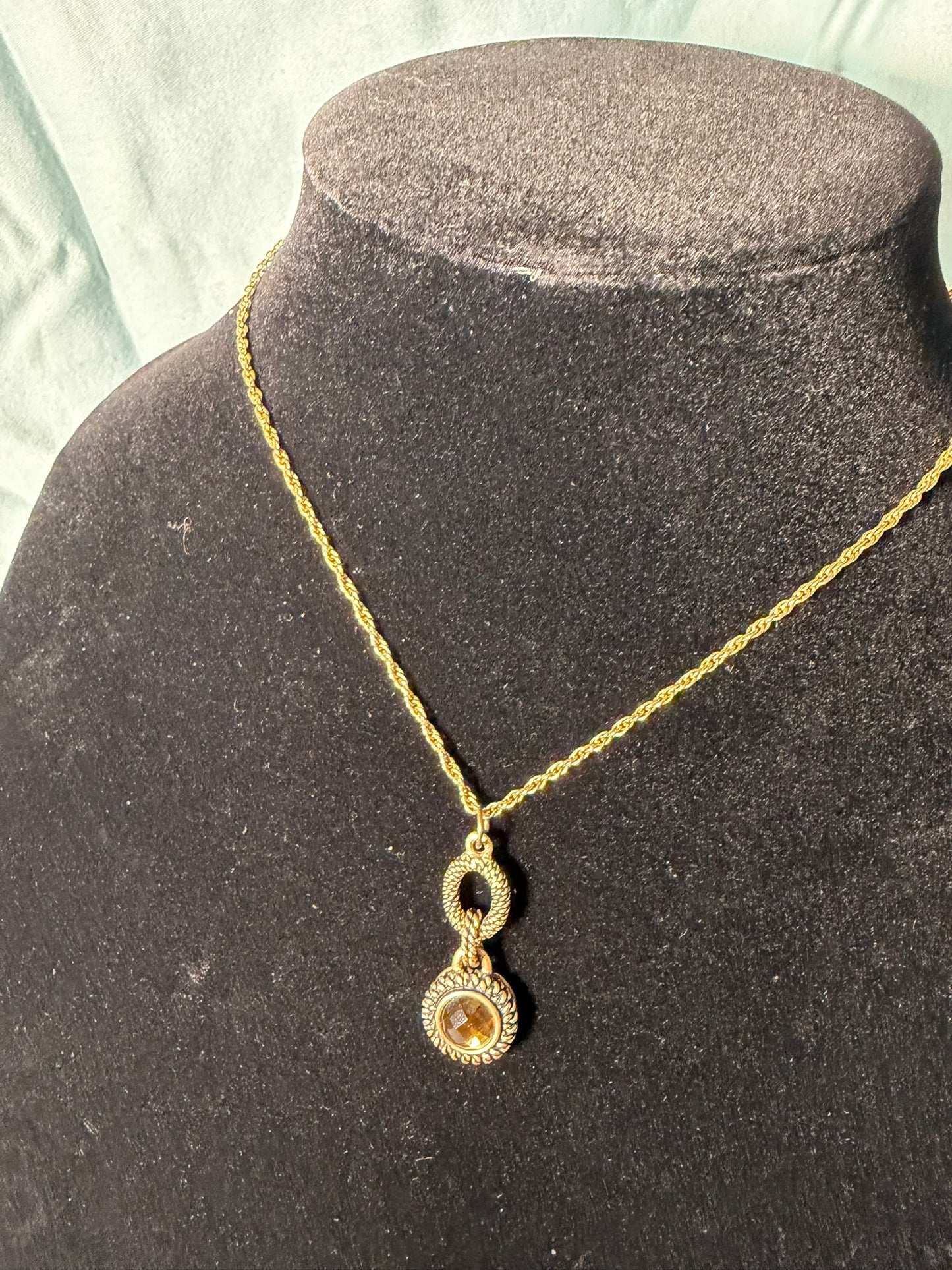 Gold‑Tone Rope Chain Necklace With Two‑Tier Ornate Pendant and Amber‑Colored Center Stone