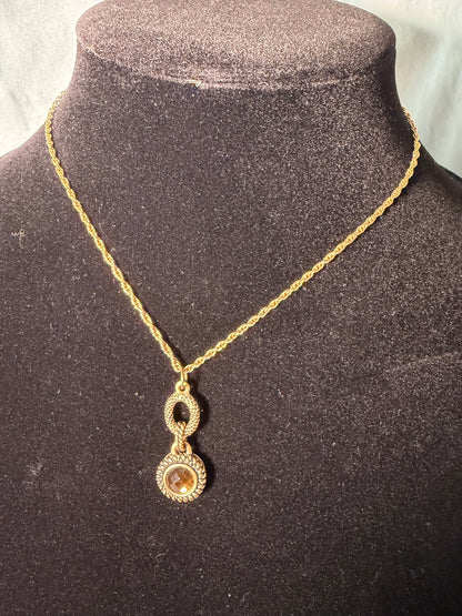 Gold‑Tone Rope Chain Necklace With Two‑Tier Ornate Pendant and Amber‑Colored Center Stone