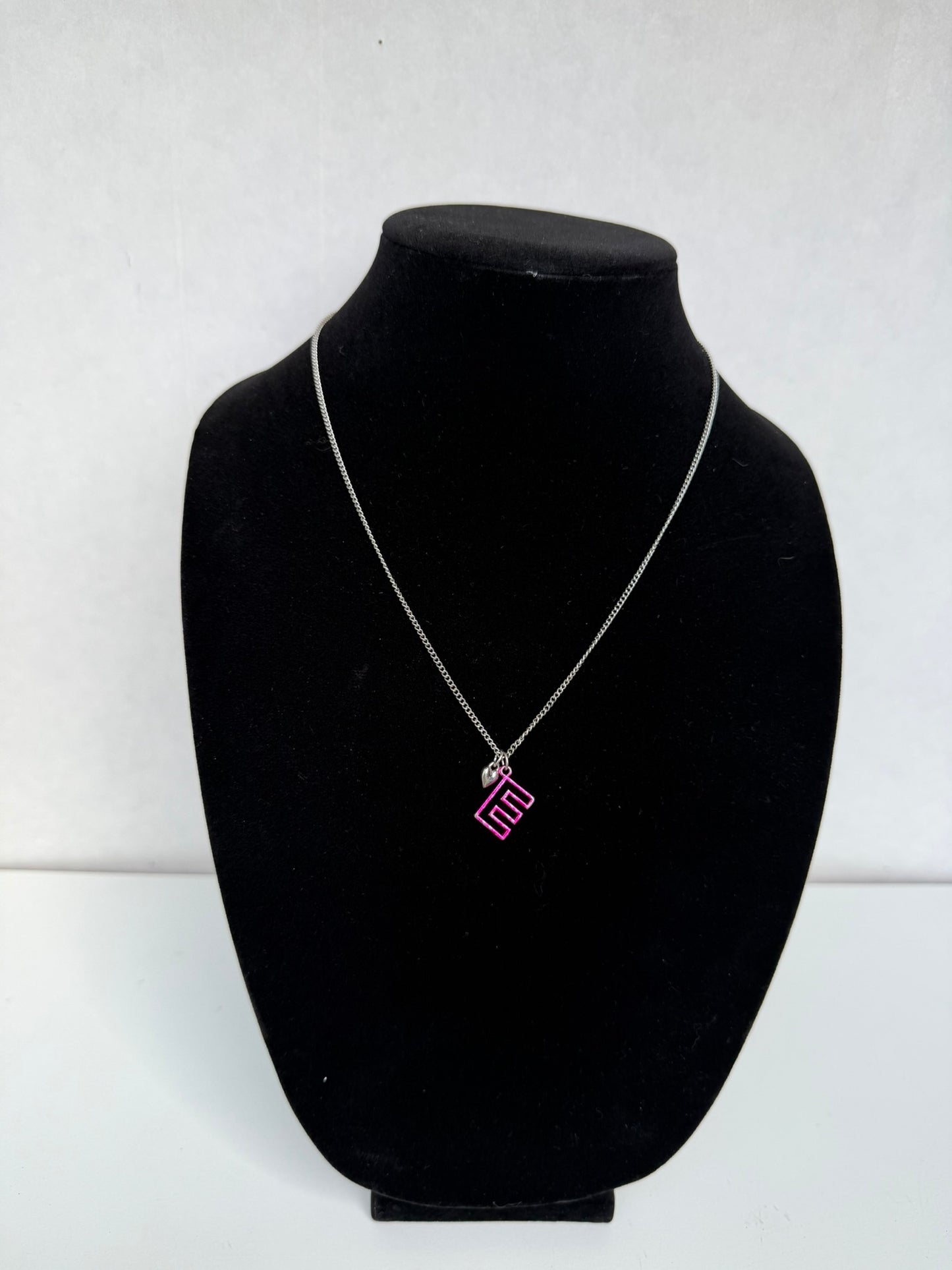 Silver‑Tone Necklace With Pink Geometric Initial Pendant and Mini Heart Charm