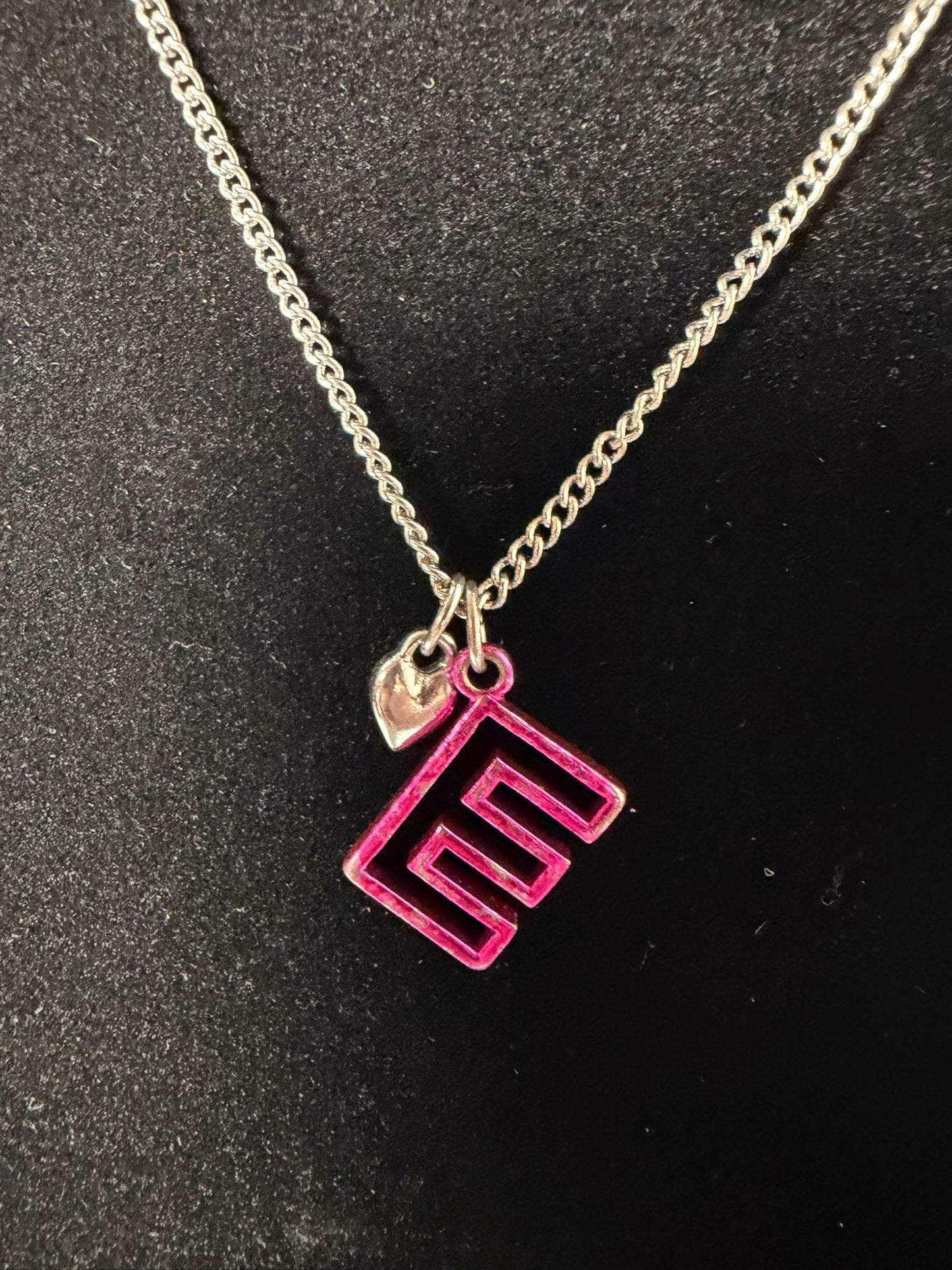 Silver‑Tone Necklace With Pink Geometric Initial Pendant and Mini Heart Charm